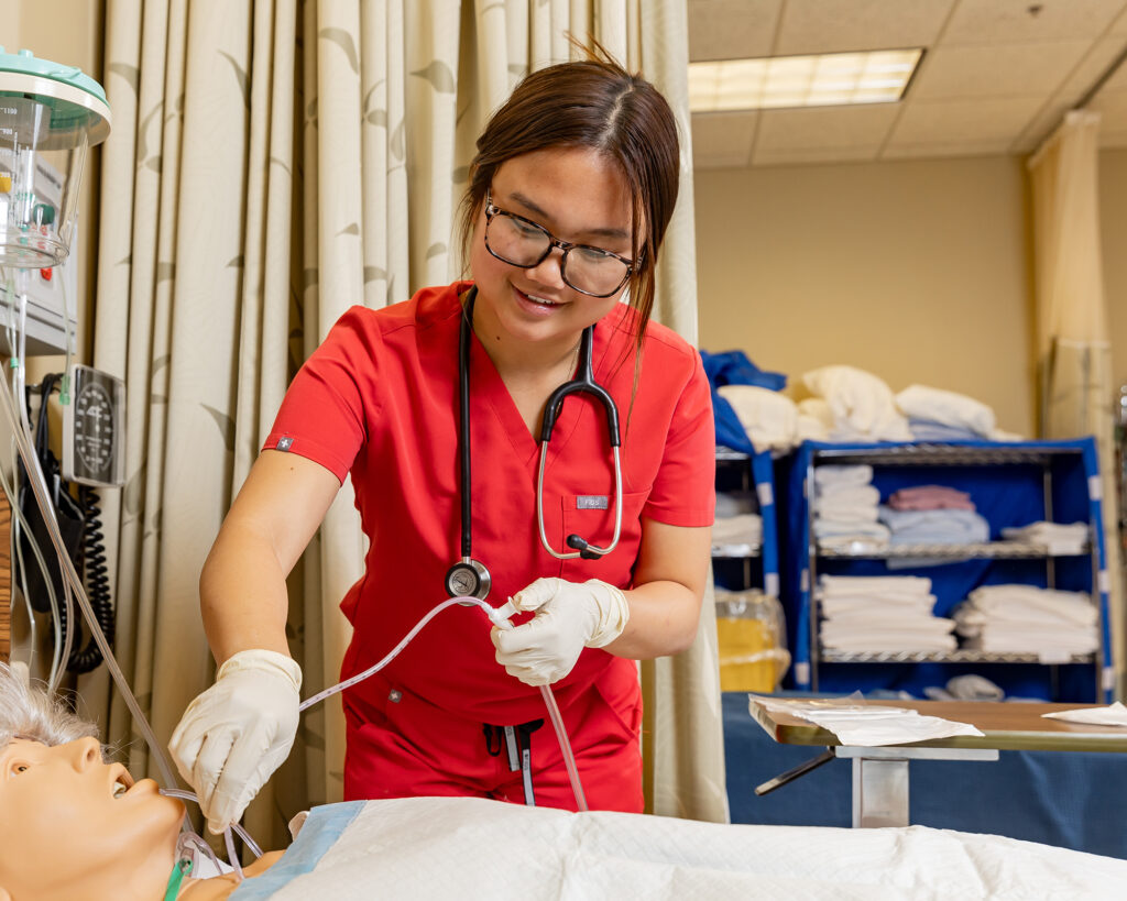 Northland female nursing student in lab.