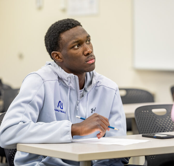 Northland student-athlete in economics class.