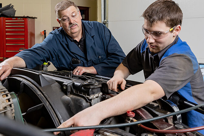 Automotive students working in lab.