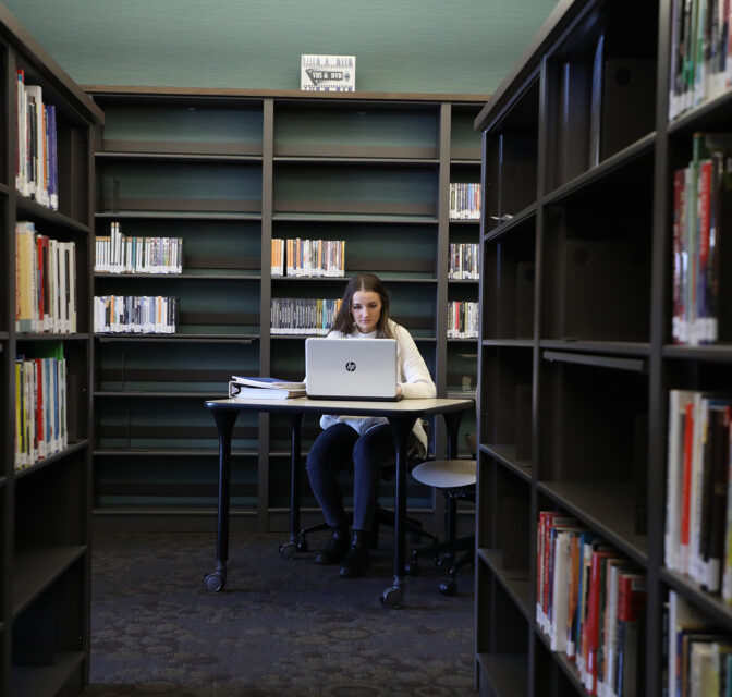 Liberal arts student in library