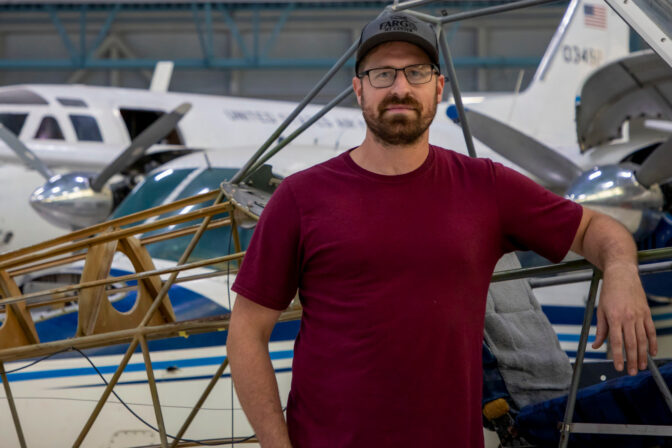 Student in aerospace hangar