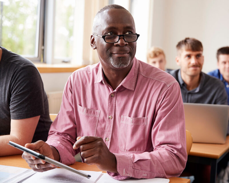 Student in class with an iPad