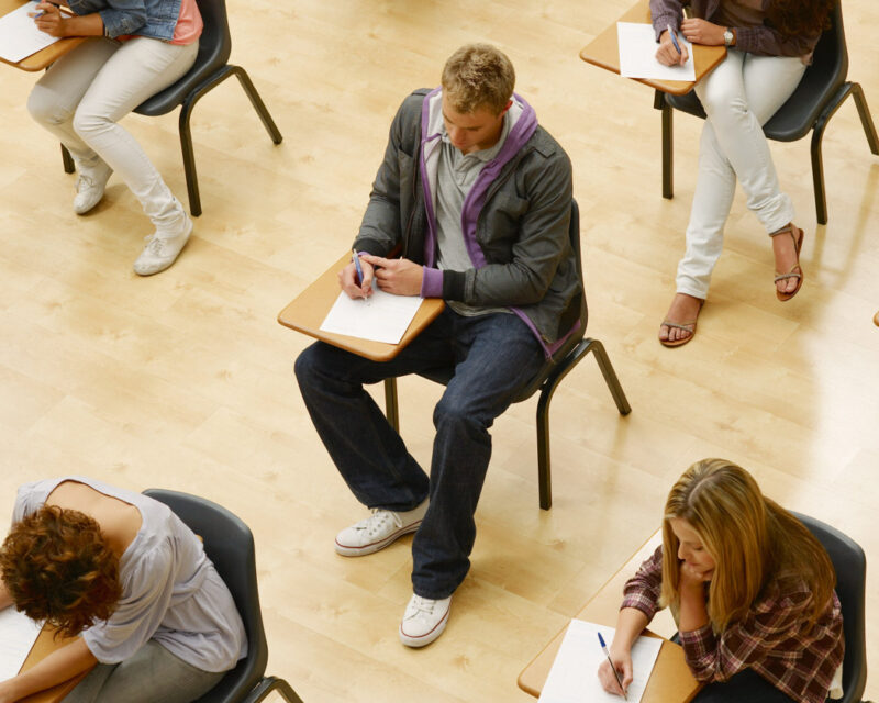 Student sitting at desks in class